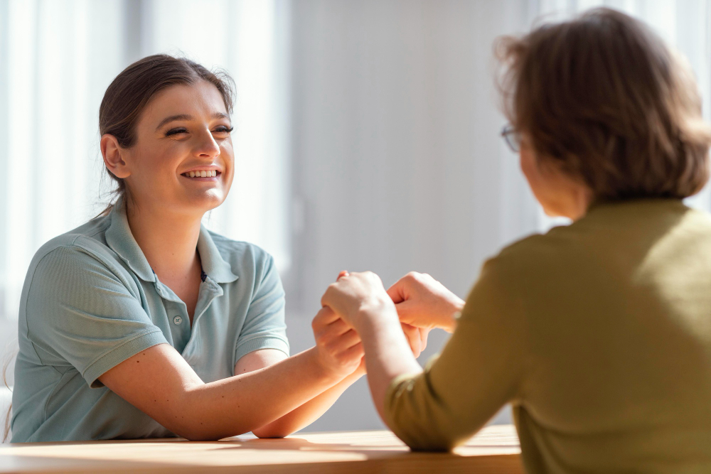 medium-shot-women-holding-hands-indoors